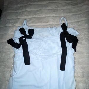 This is a blue dress with black bows, never worn, and super soft material.